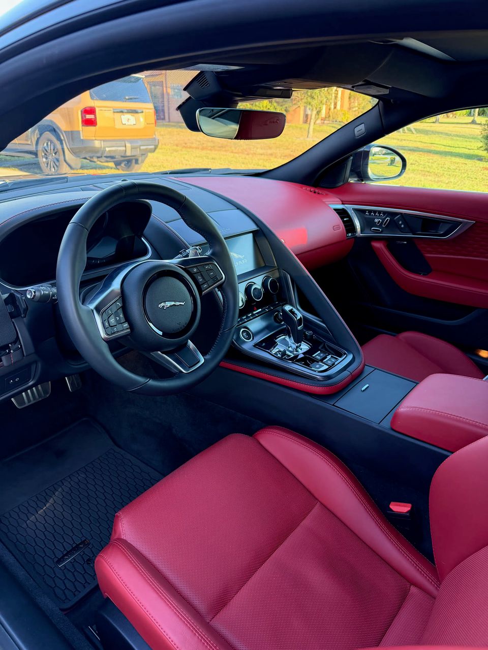 Freshly detailed red and black vehicle interior